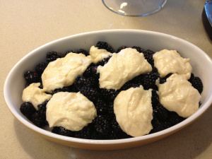 before cobbler gets baked , with biscuit topping